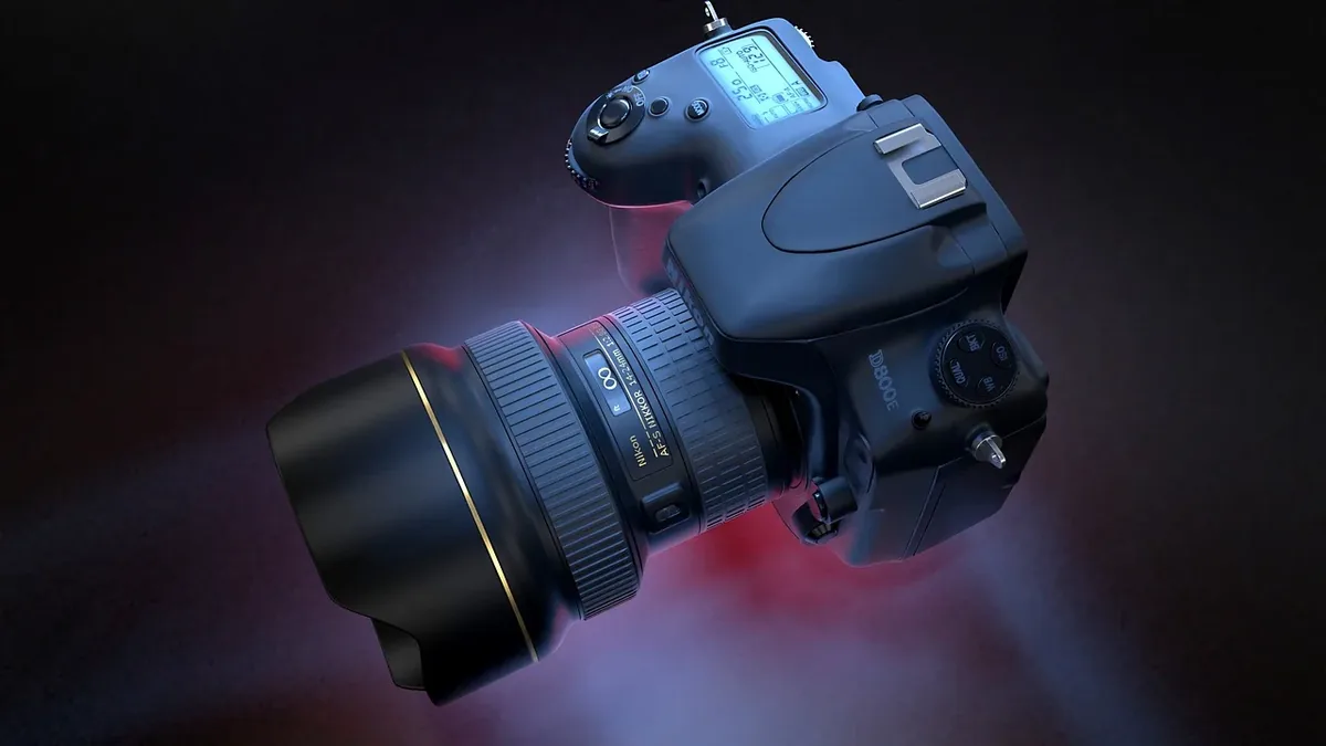 A camera with a lens and a remote control.